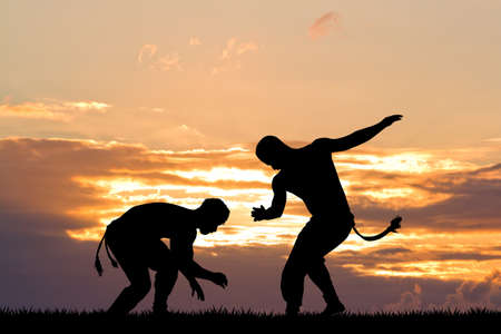 capoeira dance at sunsetの写真素材
