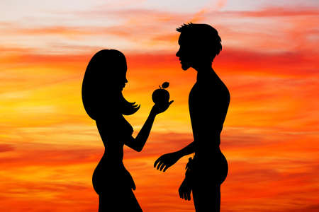 Adam and Eve with the fruit of sin at sunsetの写真素材