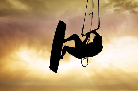 kite surfer at sunsetの写真素材