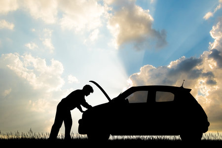 man repairing car