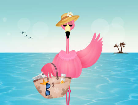 pink flamingos with beach bag on the beachの写真素材