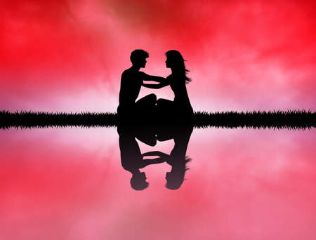 couple in meditation on riverの写真素材