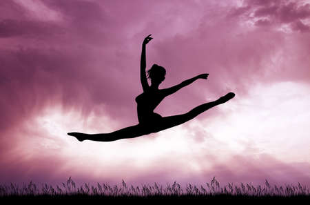 girl does the splits at sunsetの写真素材