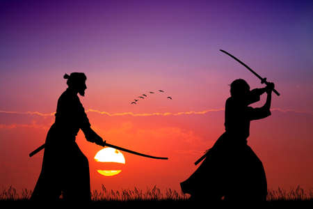 two Samurai with sword at sunsetの写真素材