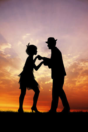 illustration of couple dances charleston at sunsetの写真素材