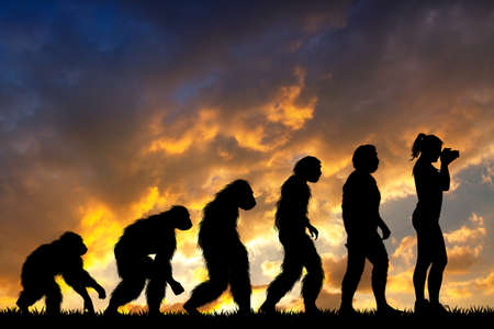 human evolution with photographer girlの写真素材