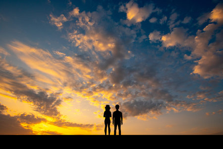 silhouette of the couple at sunsetの写真素材