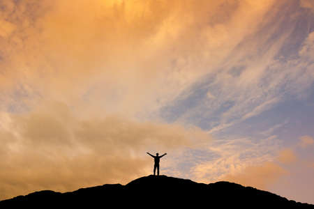 man on top of the mountainの写真素材