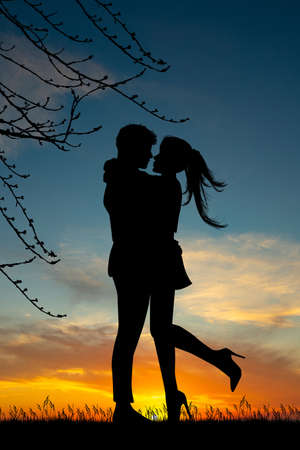 man and woman meet at sunsetの写真素材