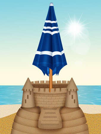 beach umbrella on sand castle on the beachの写真素材