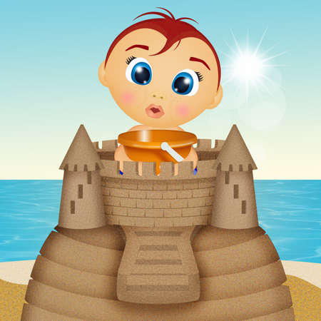 child builds castle on the beachの写真素材
