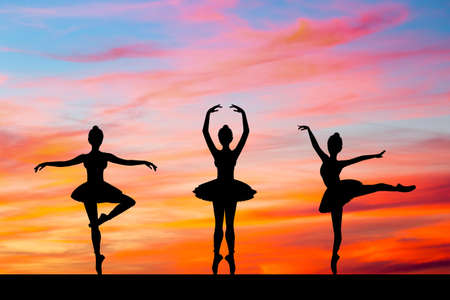 illustration of dancers girls at sunsetの写真素材