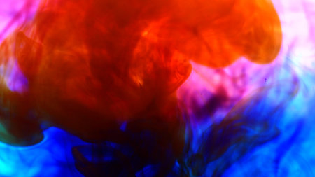 Bright colorful background Blue and red Liquid ink colors blending in water.