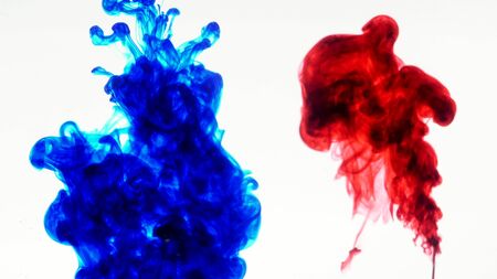 Color Ink flowing in water on white background.の写真素材