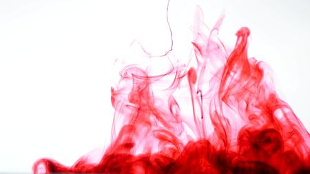 Red ink in water Abstract.の写真素材