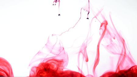 Red ink in water Abstract.の写真素材