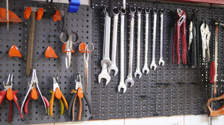 Variety of tools organized on wall.