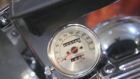 Close-up of speedometer on motorcycle.