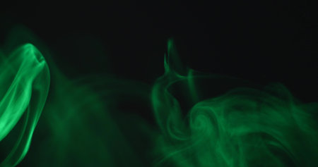 Green smoke on a black background.の写真素材