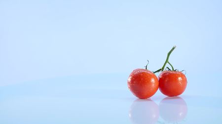 Tomatoes isolated on white background.Brunch of tomatoes rotating .の写真素材