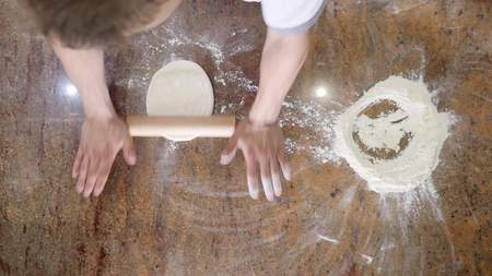 Chef preparing a pizza. Pizza Place. Food Preparation. Pizza Chef.Chef tossing pizza dough in commercial kitchen.の写真素材