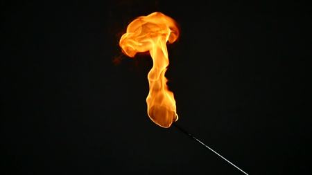 one torch for fireshow burns, slow motion.の写真素材