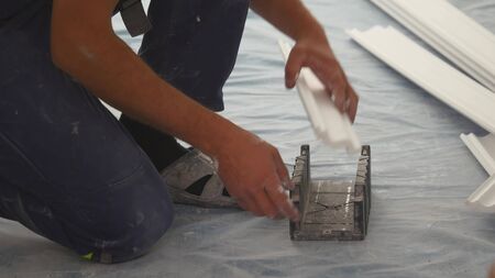 working sawing of ceiling skirting.の写真素材