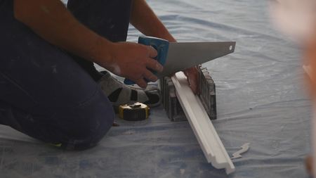 working sawing of ceiling skirting.の写真素材