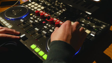 Swooping across the faders and channels of an SSL recording board in a music studio.