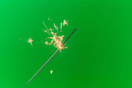Sparkler isolated on green screen backgroundの写真素材