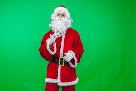 Santa dancing in front of the camera.の写真素材