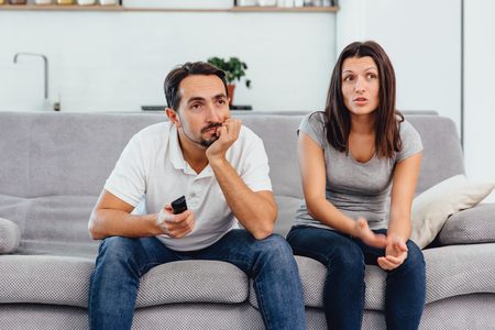 A man and a woman watch a movieの写真素材