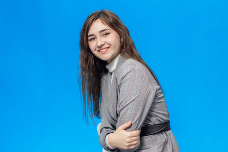 Girl on a blue background is isolatedの写真素材