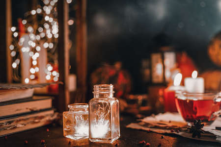 sparks from the fire in two glass jarsの写真素材