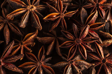 macrophotography of star anise on a wooden background. spice star anise is closeの写真素材