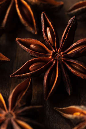 macrophotography of star anise on a wooden background. spice star anise is closeの写真素材