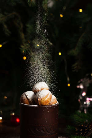 cookies in the form of nuts in a glass. Powdered sugar is poured on top.の写真素材
