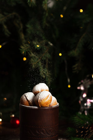 cookies in the form of nuts in a glass. Powdered sugar is poured on top.の写真素材