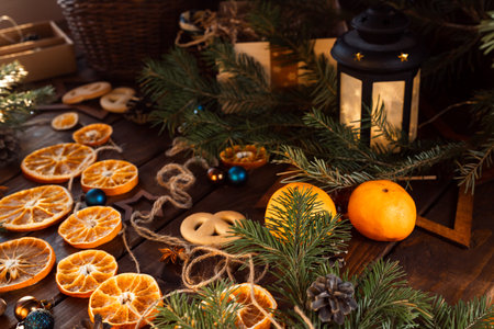 Dried slices of oranges cut into circles lie on a wooden table. New Year's Flatley.の写真素材