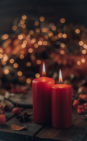 candles are lit on a wooden table. Candles surrounded by lightsの写真素材