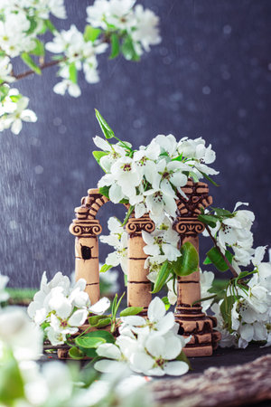 ruins with columns in white flowers. Blooming apple tree branches next to the Greek columnsの写真素材