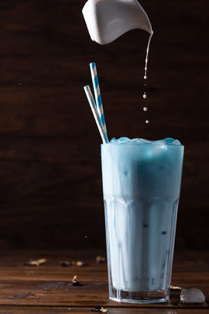 blue latte. Milk is added to blue Anchan tea from aboveの写真素材