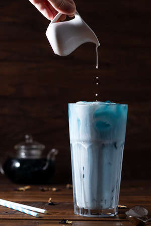 blue latte. Milk is added to blue Anchan tea from aboveの写真素材
