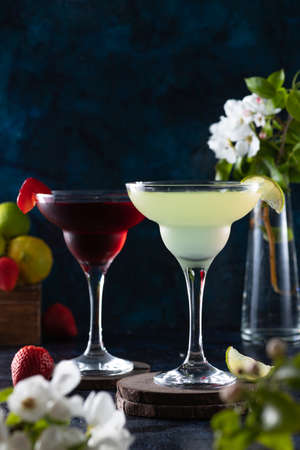 margarita glass is full of drink. margarita cocktail is on the table.の写真素材