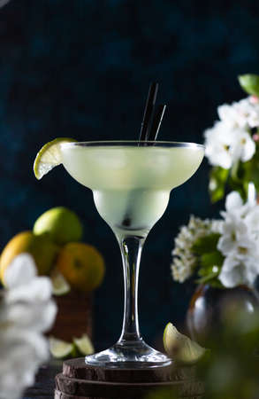 margarita glass is full of drink. margarita cocktail is on the table.の写真素材