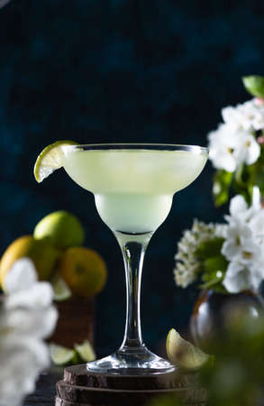 margarita glass is full of drink. margarita cocktail is on the table.の写真素材