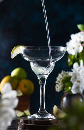 margarita glass is full of drink. margarita cocktail is on the table.の写真素材