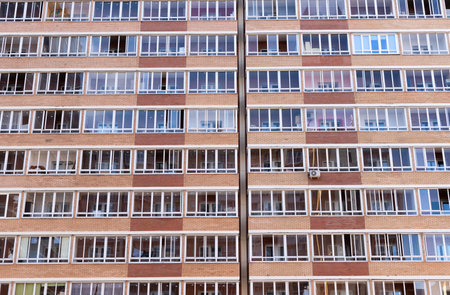 High-rise multi-storey building from below, many windowsの写真素材