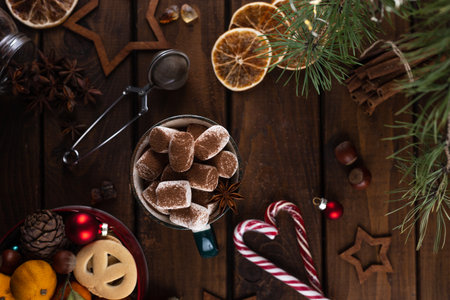 A mug of hot cocoa with marshmallows is sprinkled on top of cocoaの写真素材