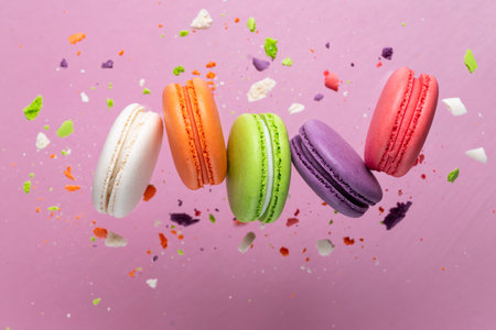 Colorful macaroni cookies with crumbsの写真素材